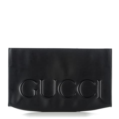 gucci embossed clutch.